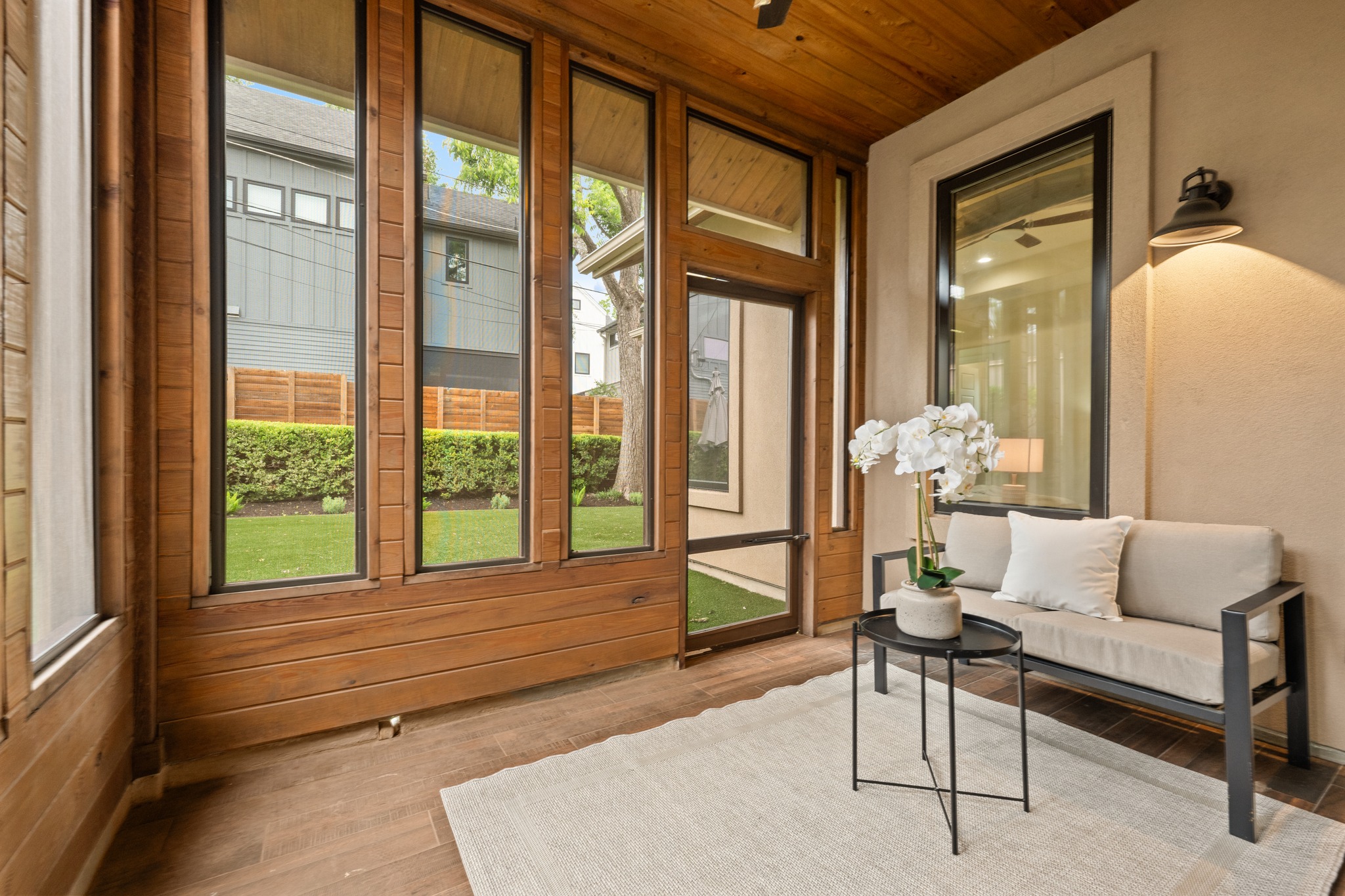 3907 Bailey Lane Austin, TX 78756 - Photo 29 of 40 The picturesque, enclosed patio looks out over the private backyard, creating a space you will long to be in
