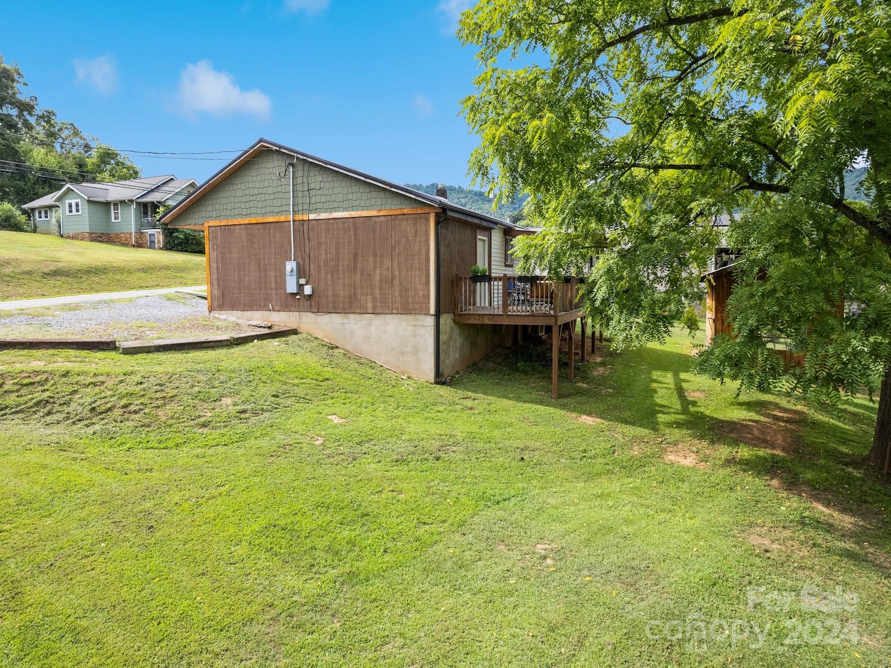 464 Thompson Cove Road Clyde, NC 28721 - Photo 3 of 36 a view of a house with a yard