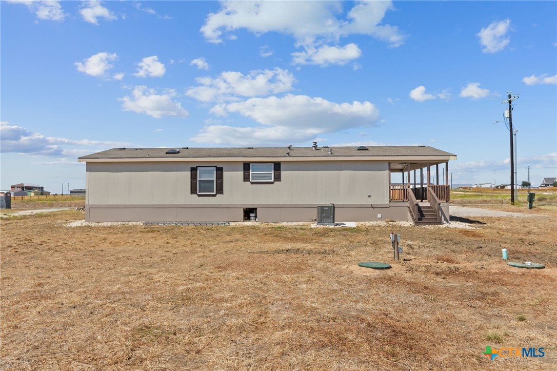 183 Altamira Avenue Elgin, TX 78621 - Photo 36 of 37 a front view of a house with a garden