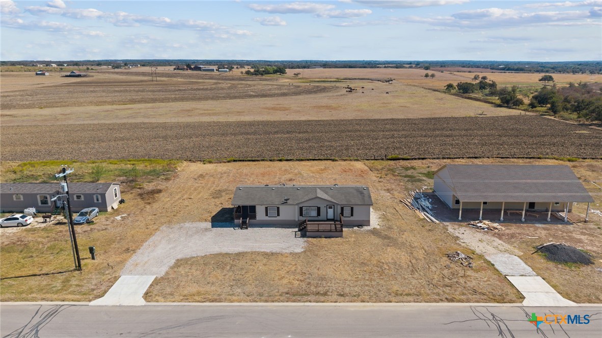 183 Altamira Avenue Elgin, TX 78621 - Photo 4 of 37 a view of a swimming pool with an ocean view