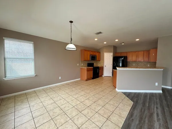 a kitchen with stainless steel appliances granite countertop a sink and a stove