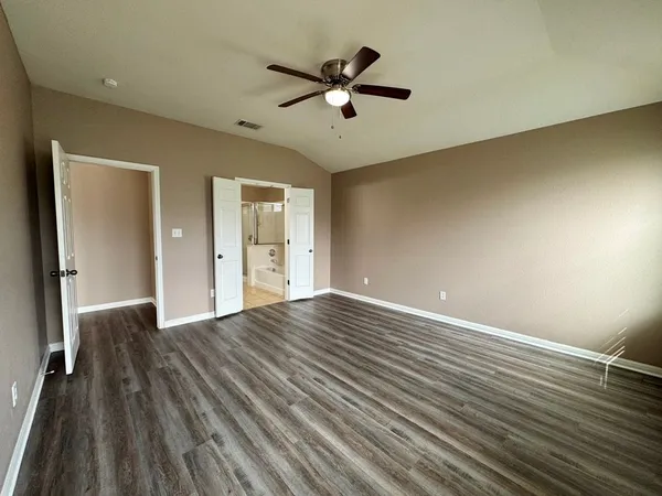 a bathroom with a mirror and a shower