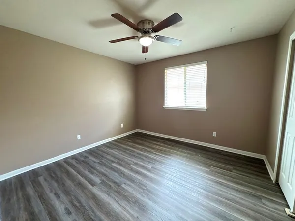 a view of storage and utility room with racks on the wall
