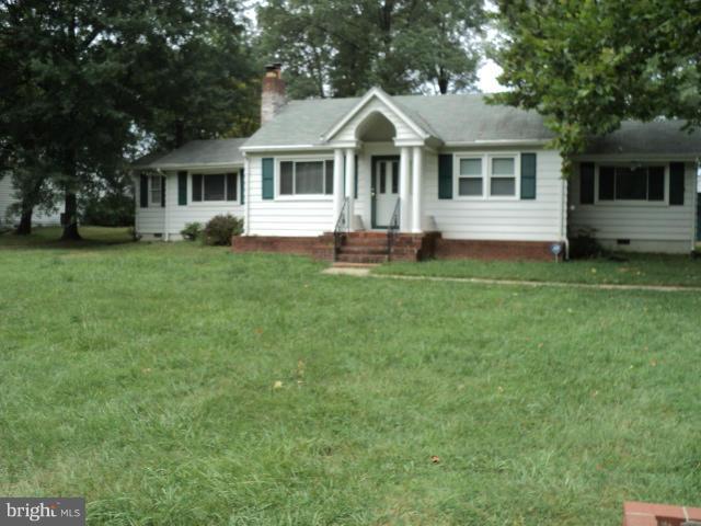 6702 Springbrook Lane Clinton, MD 20735 - Photo 1 of 30 a front view of a house with a garden