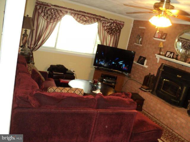 6702 Springbrook Lane Clinton, MD 20735 - Photo 13 of 30 a living room with furniture and a flat screen tv