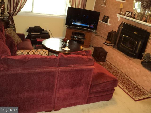 6702 Springbrook Lane Clinton, MD 20735 - Photo 14 of 30 a living room with furniture and a flat screen tv