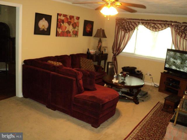6702 Springbrook Lane Clinton, MD 20735 - Photo 15 of 30 a living room with furniture and a flat screen tv