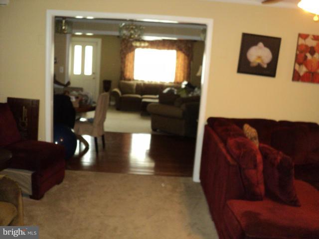 6702 Springbrook Lane Clinton, MD 20735 - Photo 17 of 30 a living room with furniture and wooden floor