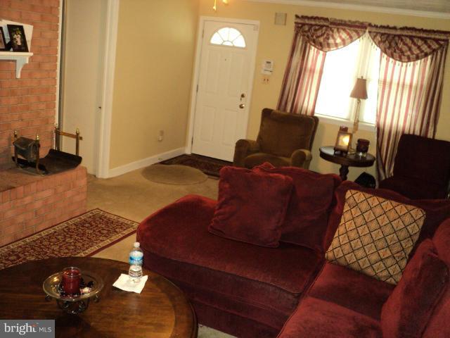 6702 Springbrook Lane Clinton, MD 20735 - Photo 19 of 30 a living room with furniture and a window