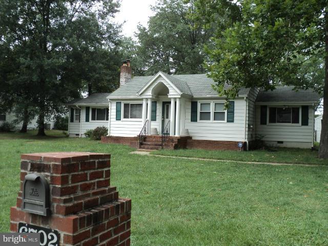 6702 Springbrook Lane Clinton, MD 20735 - Photo 24 of 30 a front view of a house with a yard