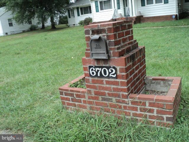 6702 Springbrook Lane Clinton, MD 20735 - Photo 25 of 30 a front view of a house with garden