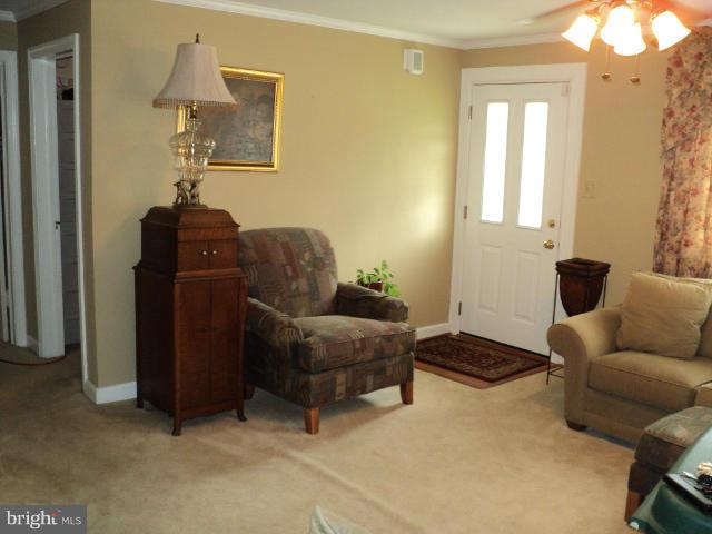 6702 Springbrook Lane Clinton, MD 20735 - Photo 8 of 30 a living room with furniture and a window