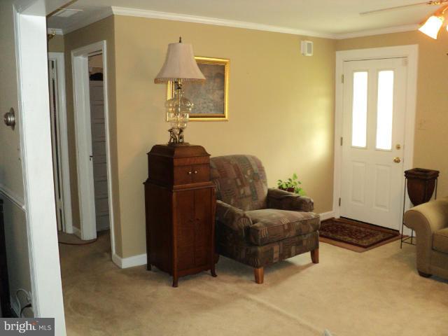 6702 Springbrook Lane Clinton, MD 20735 - Photo 9 of 30 a living room with furniture and a window