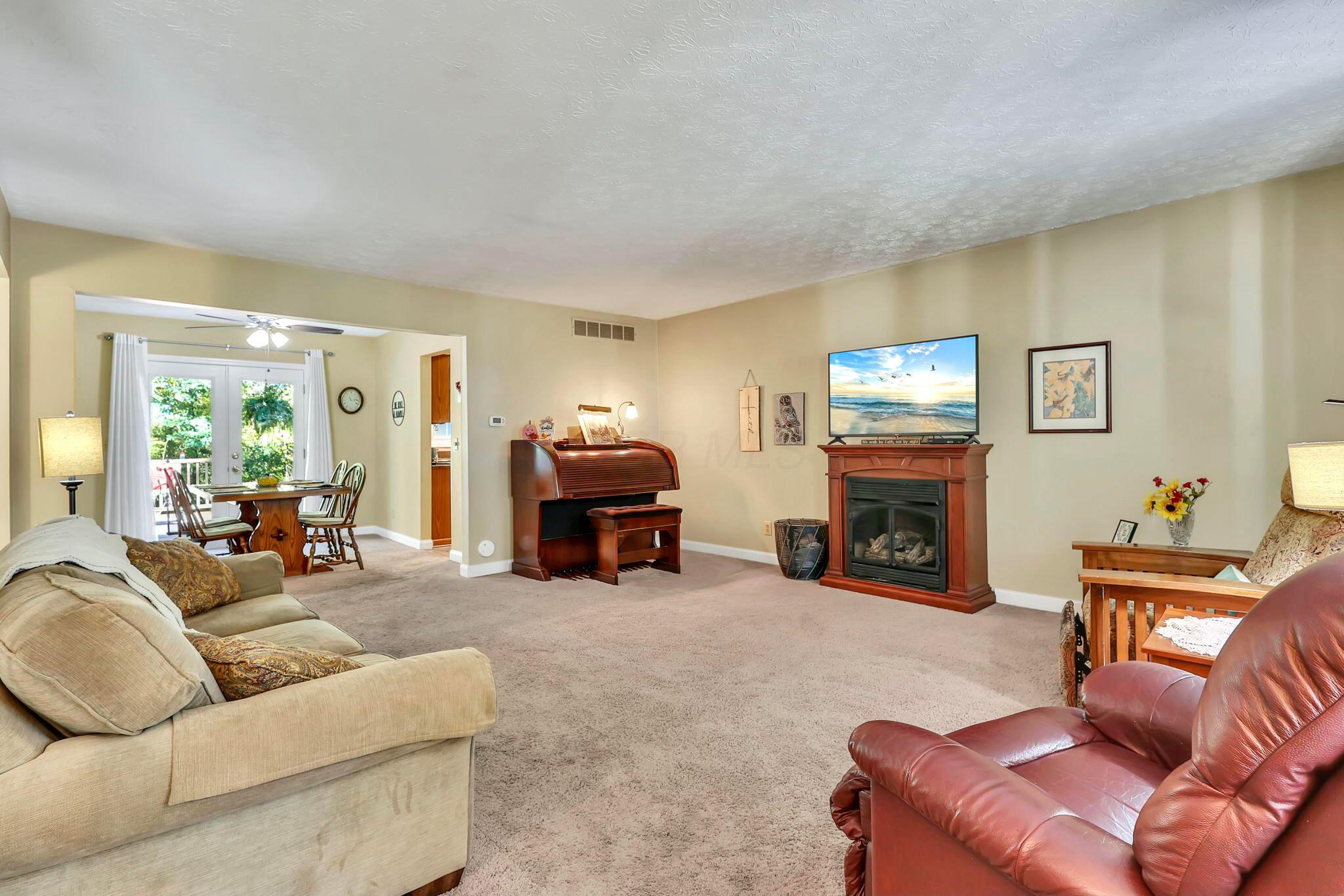 7420 Brown Road Ostrander, OH 43061 - Photo 13 of 77 Living room has a gas fireplace.