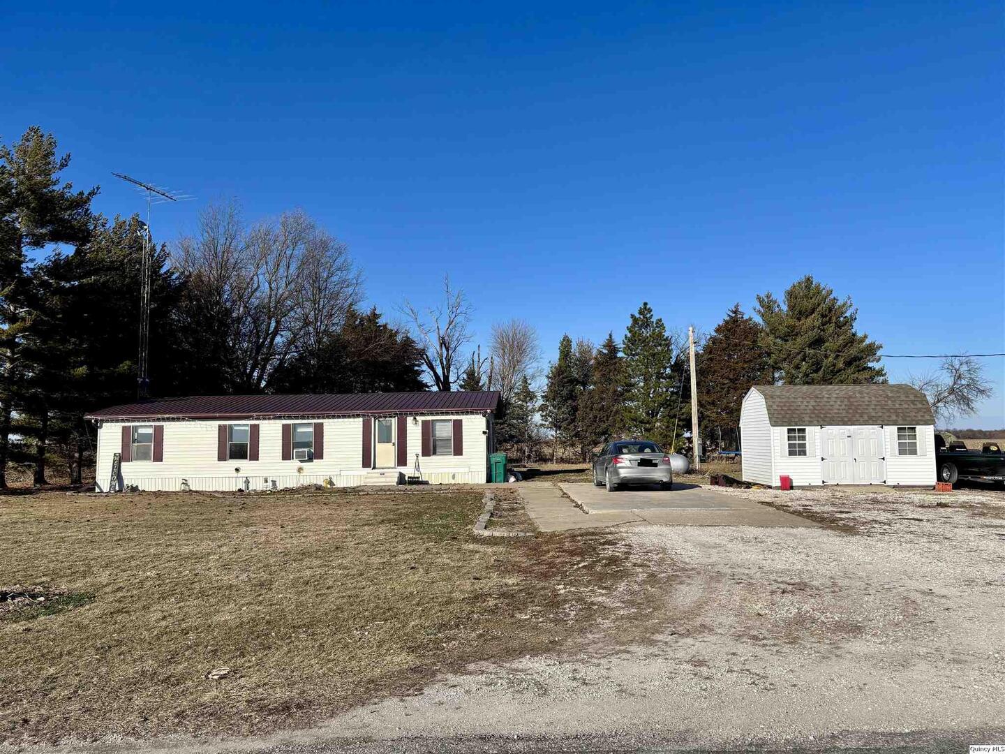 2330 East Co Road 1400 Carthage, IL 62321 - Photo 1 of 19 a view of a house with outdoor space and sitting area