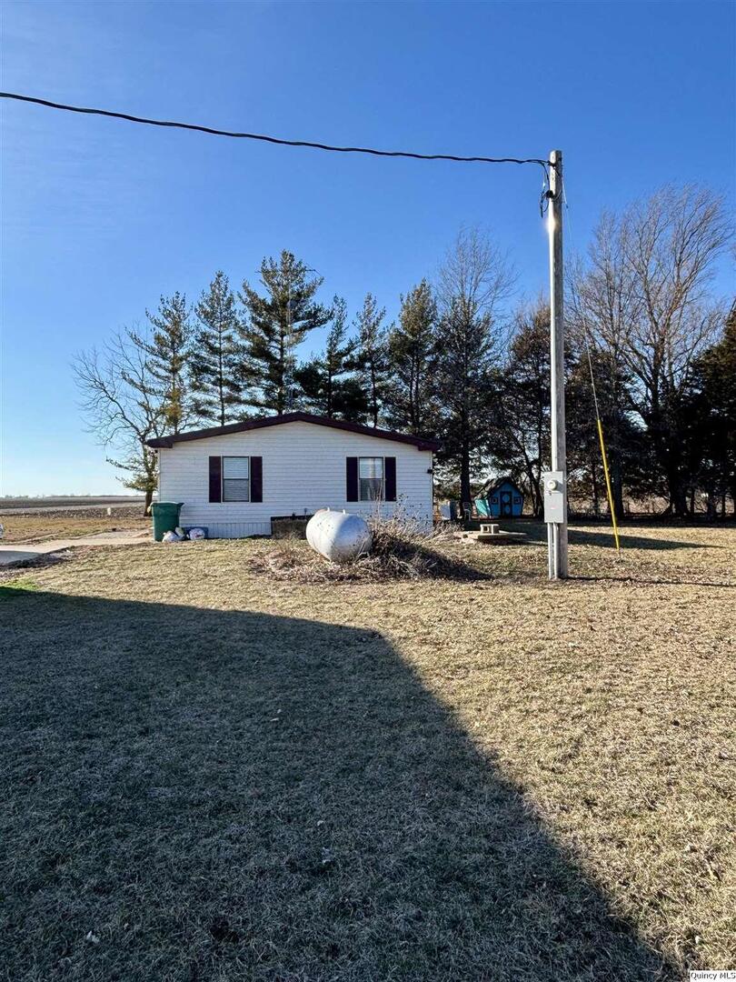 2330 East Co Road 1400 Carthage, IL 62321 - Photo 17 of 19 a view of a house with a yard