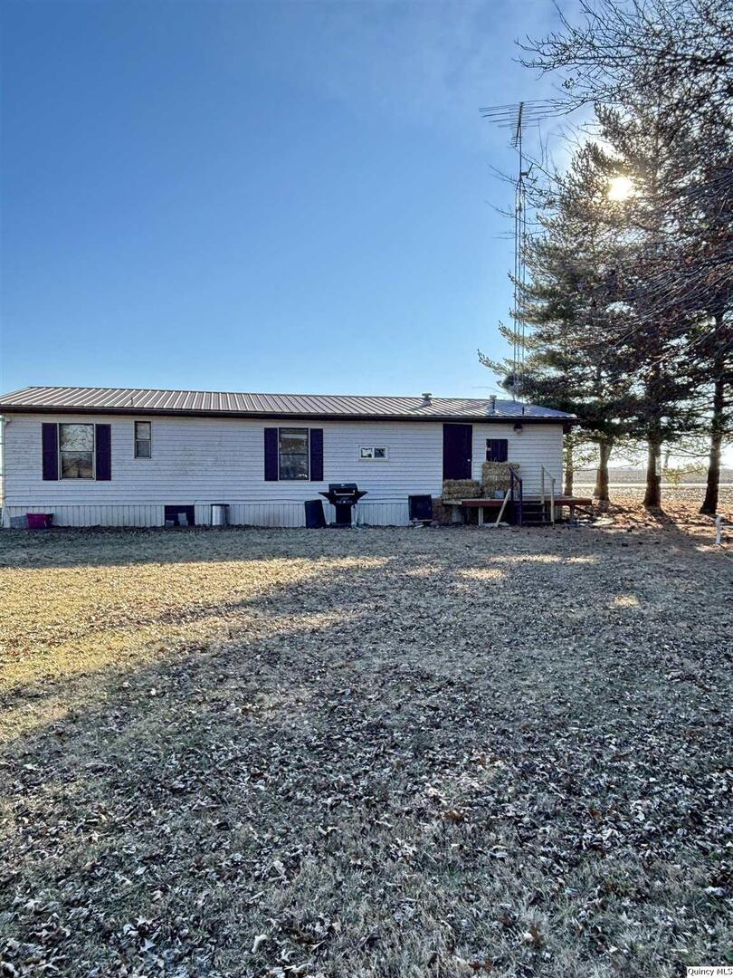 2330 East Co Road 1400 Carthage, IL 62321 - Photo 19 of 19 a view of a house with a yard and sitting area