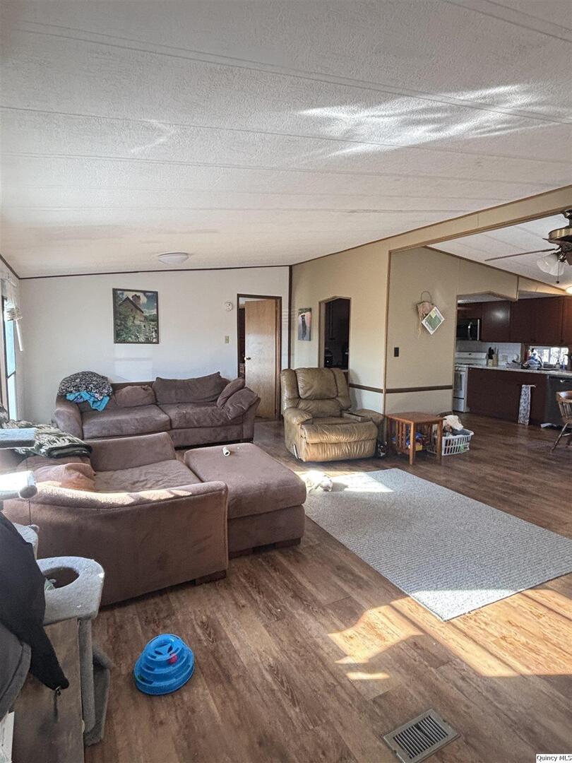 2330 East Co Road 1400 Carthage, IL 62321 - Photo 2 of 19 a living room with furniture and a table