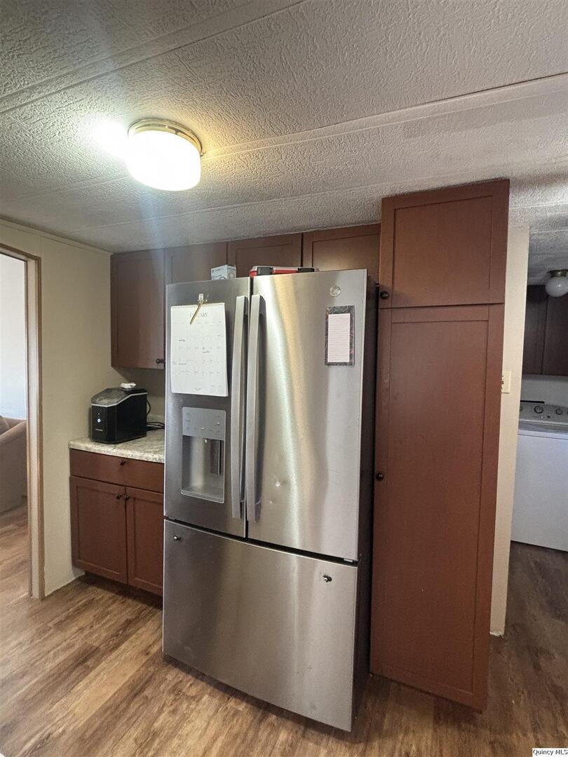 2330 East Co Road 1400 Carthage, IL 62321 - Photo 7 of 19 a metallic refrigerator freezer sitting in a kitchen