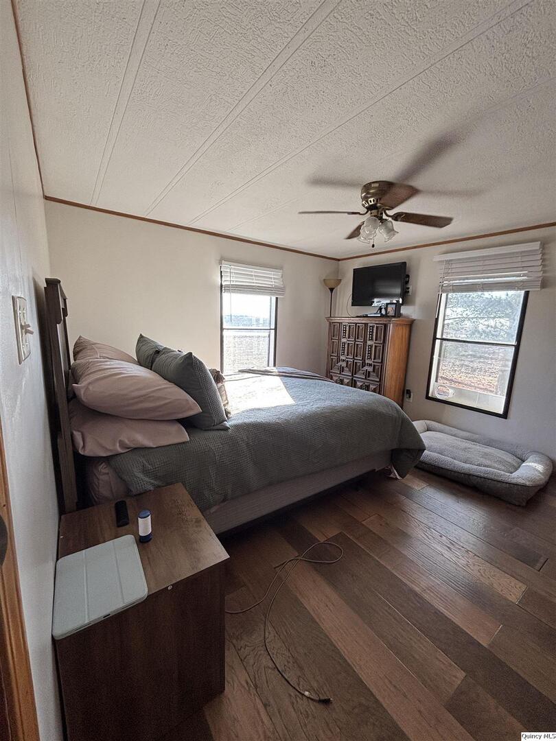2330 East Co Road 1400 Carthage, IL 62321 - Photo 9 of 19 a bedroom with furniture and wooden floor