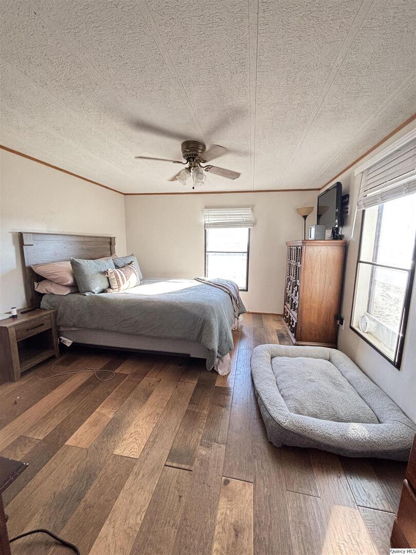 2330 East Co Road 1400 Carthage, IL 62321 - Photo 10 of 19 a bedroom with a bed and a couch