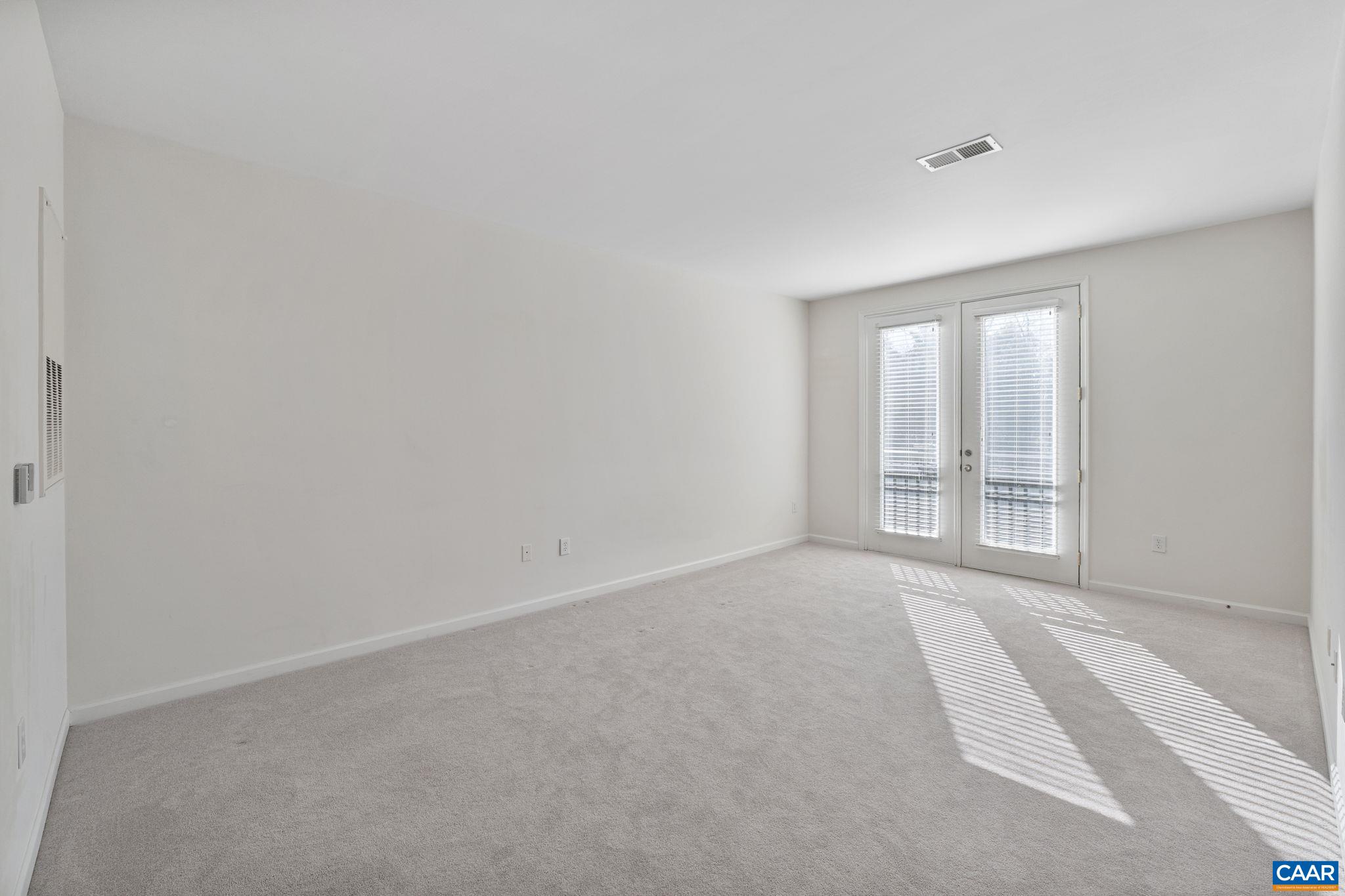 750 Walker Square, Unit 3B Charlottesville, VA 22903 - Photo 16 of 36 a view of an empty room with a window