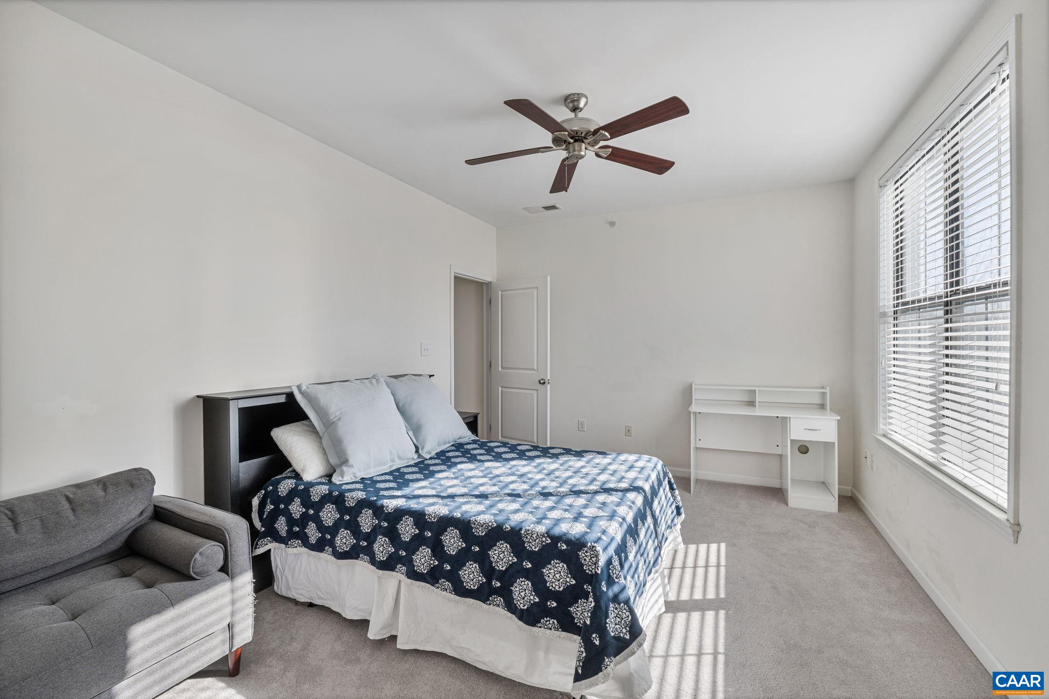 750 Walker Square, Unit 3B Charlottesville, VA 22903 - Photo 18 of 36 a bedroom with a bed and window