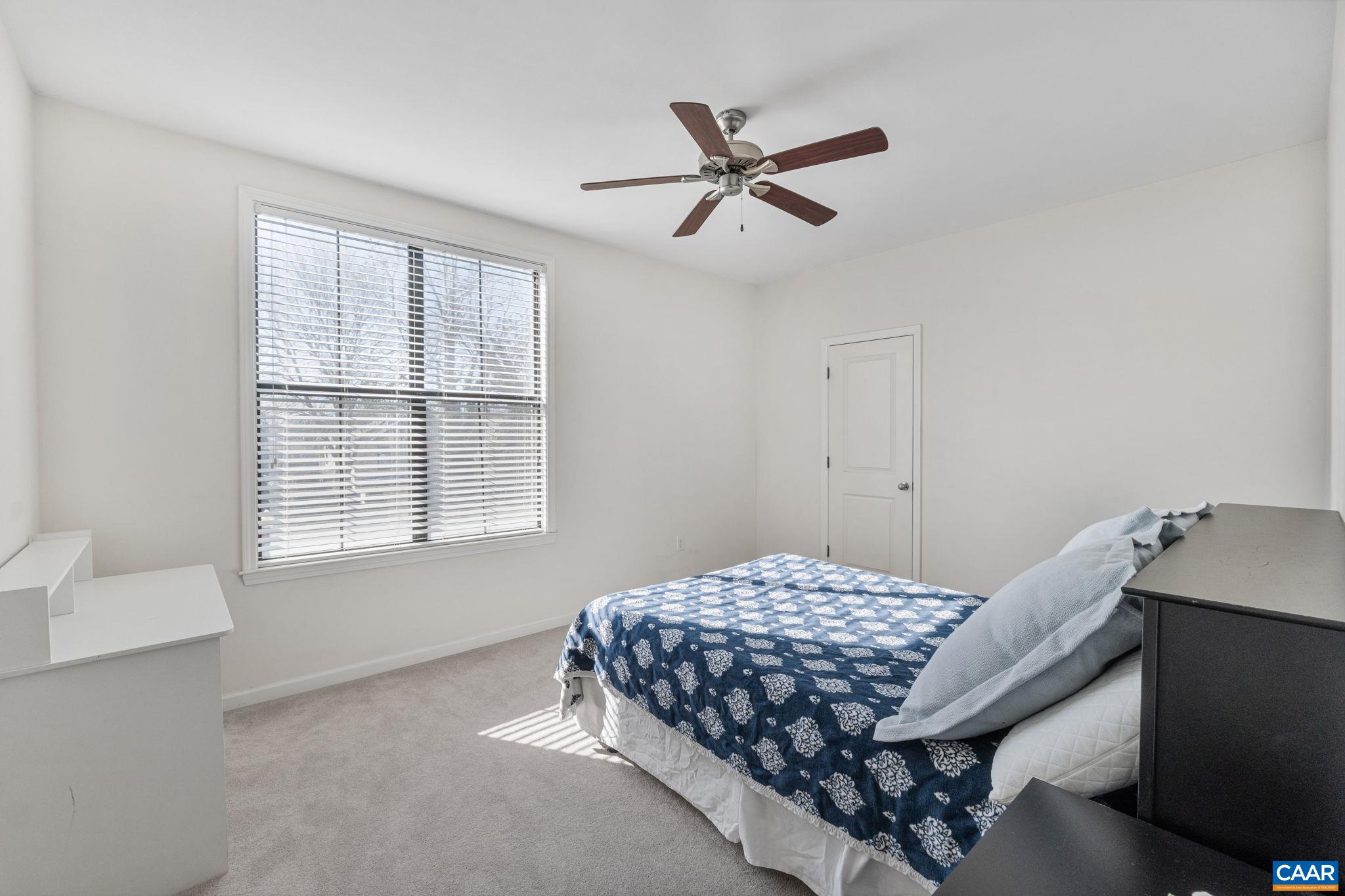 750 Walker Square, Unit 3B Charlottesville, VA 22903 - Photo 20 of 36 a bedroom with a bed and window