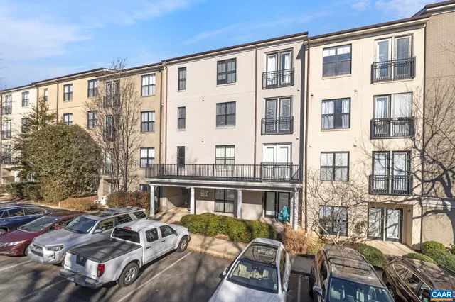 a dining table sitting next to a large window
