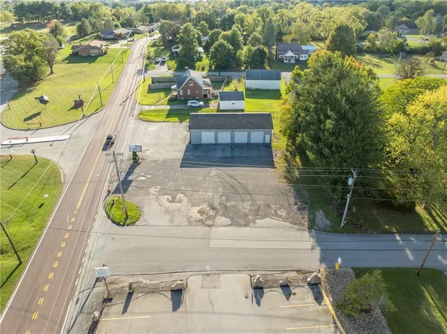 swimming pool view with a garden view
