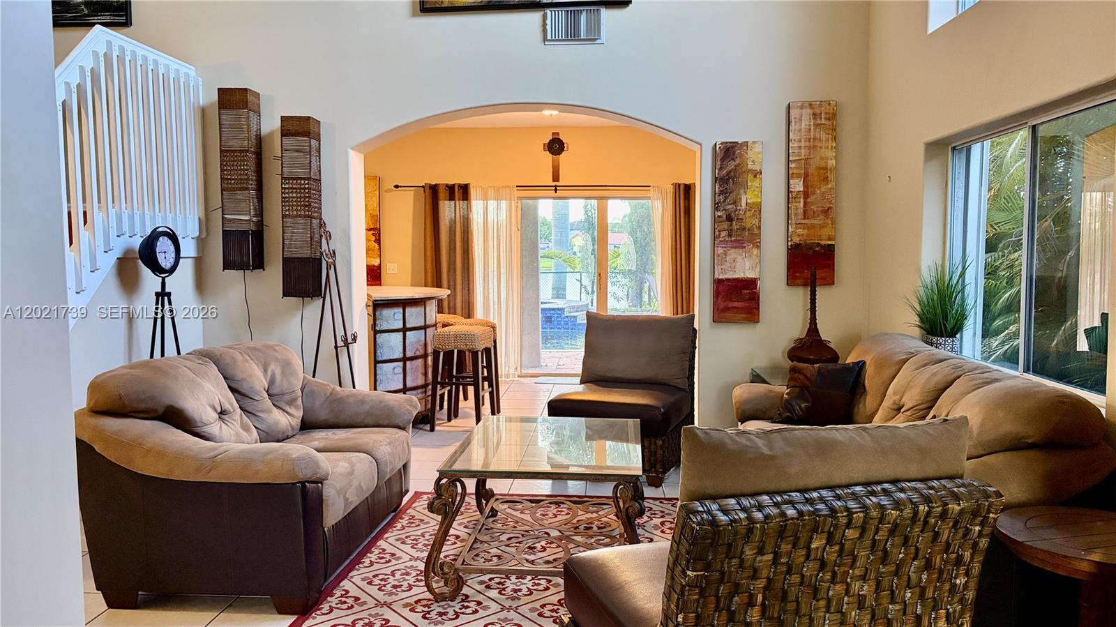 13553 Southwest 124th Avenue Road Miami, FL 33186 - Photo 7 of 31 a living room with furniture and a large window