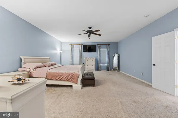a bedroom with bed and window