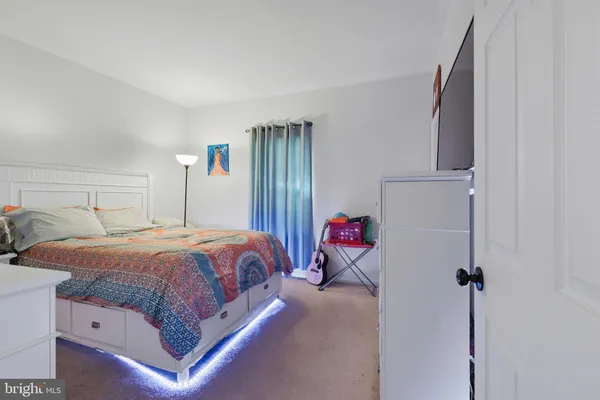 a bedroom with a bed and a closet