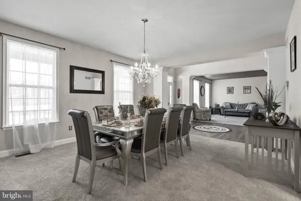 a view of a dining room with furniture and window