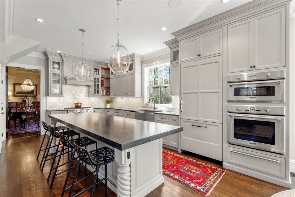215 Boston Post Road Weston, MA 02493 - Photo 15 of 37 a kitchen with stainless steel appliances granite countertop a sink a stove and a refrigerator
