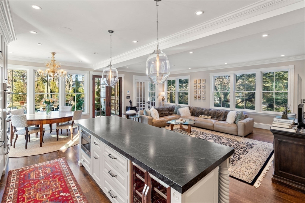 215 Boston Post Road Weston, MA 02493 - Photo 16 of 37 a living room with furniture a large window and wooden floor
