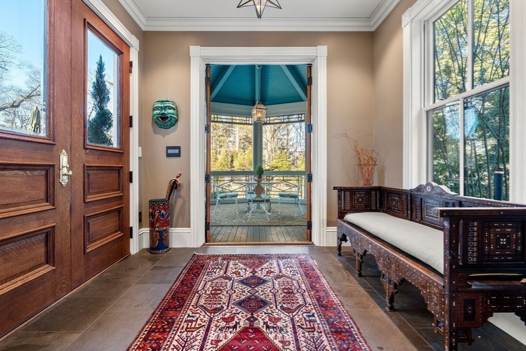 215 Boston Post Road Weston, MA 02493 - Photo 21 of 37 a living room with a bed and a window