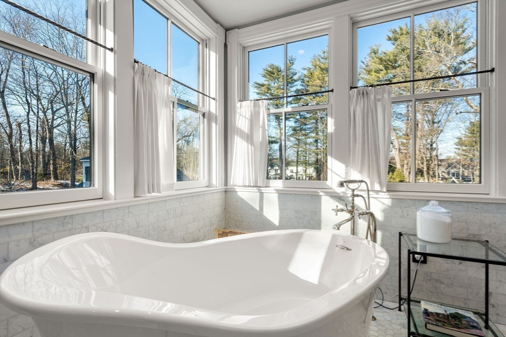 215 Boston Post Road Weston, MA 02493 - Photo 25 of 37 a white bath tub sitting in front of a window