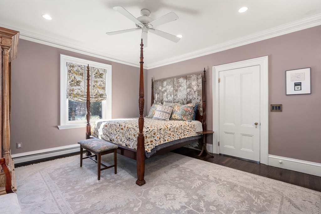 215 Boston Post Road Weston, MA 02493 - Photo 27 of 37 a bedroom with a bed and a window