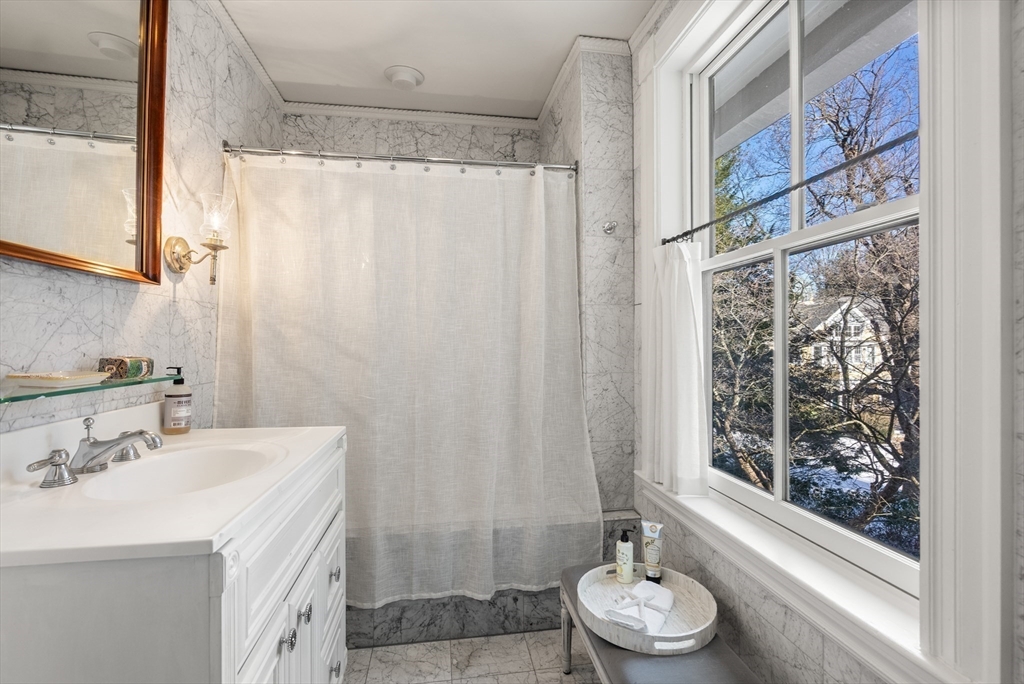 215 Boston Post Road Weston, MA 02493 - Photo 28 of 37 a bathroom with a sink toilet and shower