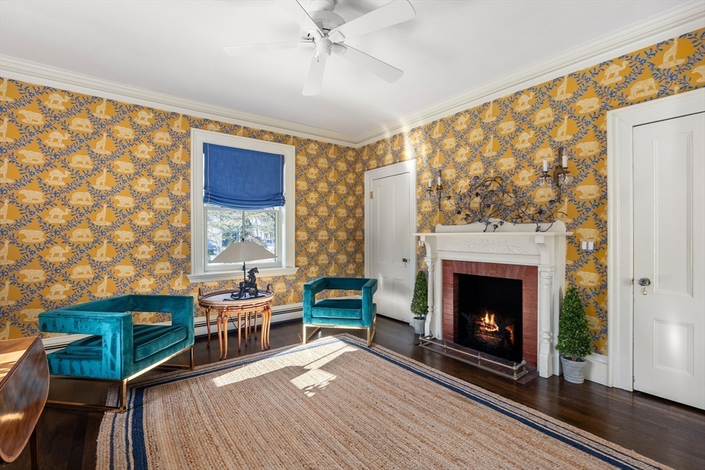 215 Boston Post Road Weston, MA 02493 - Photo 30 of 37 a living room with furniture and a fireplace