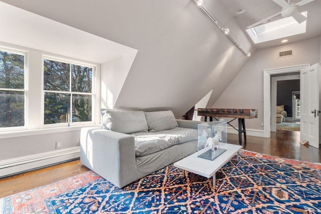 215 Boston Post Road Weston, MA 02493 - Photo 32 of 37 a living room with furniture and a rug