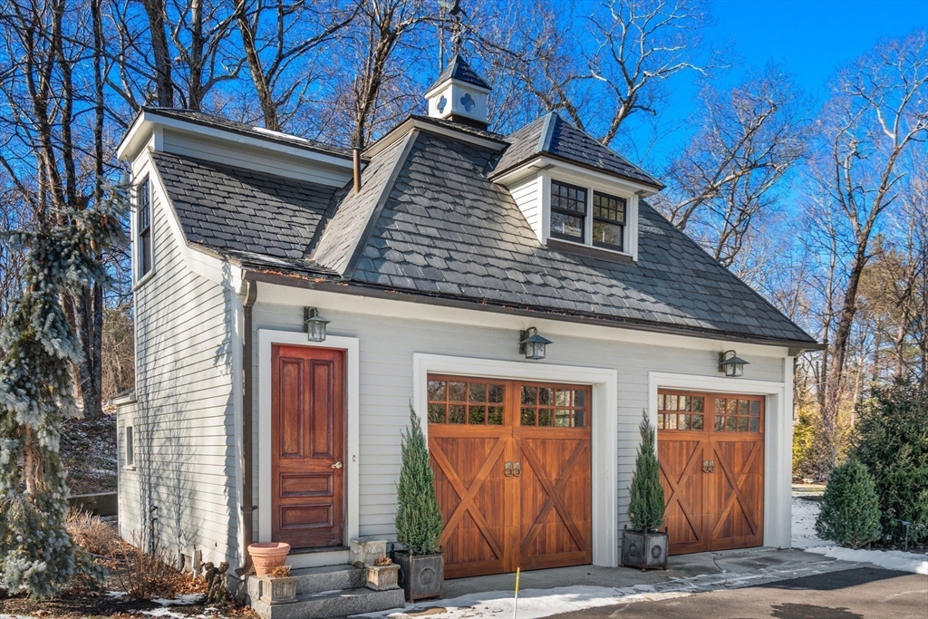 215 Boston Post Road Weston, MA 02493 - Photo 6 of 37 a front view of a house with a yard