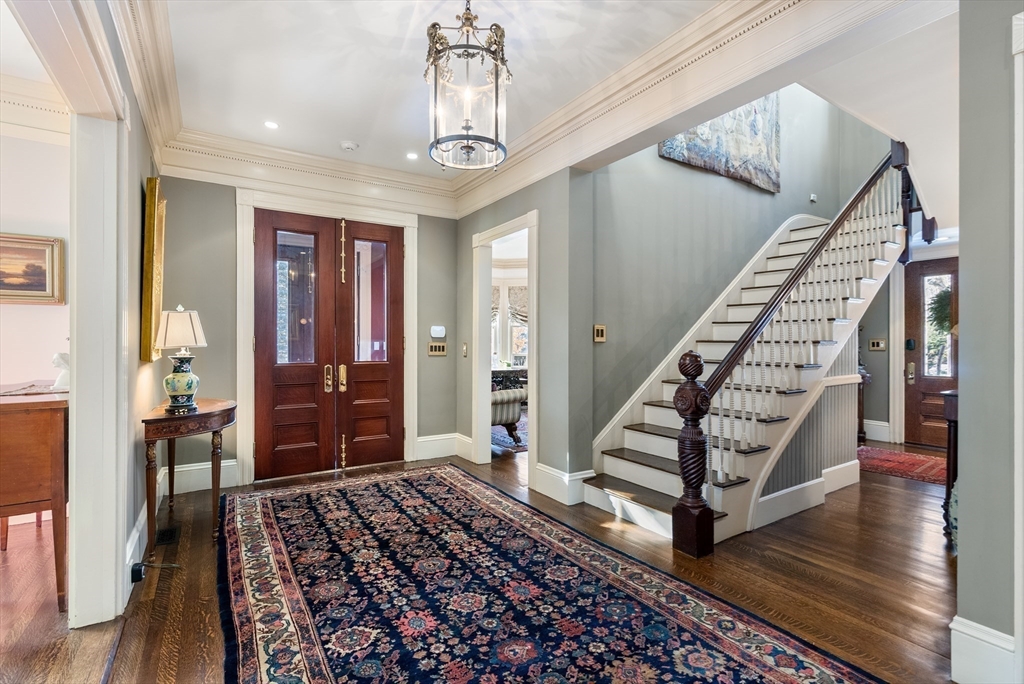 215 Boston Post Road Weston, MA 02493 - Photo 7 of 37 a view of an entryway with wooden floor and stairs