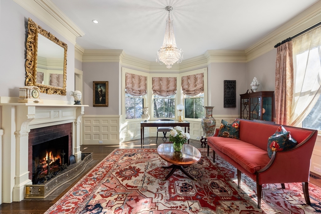 215 Boston Post Road Weston, MA 02493 - Photo 9 of 37 a living room with furniture a window and a fireplace