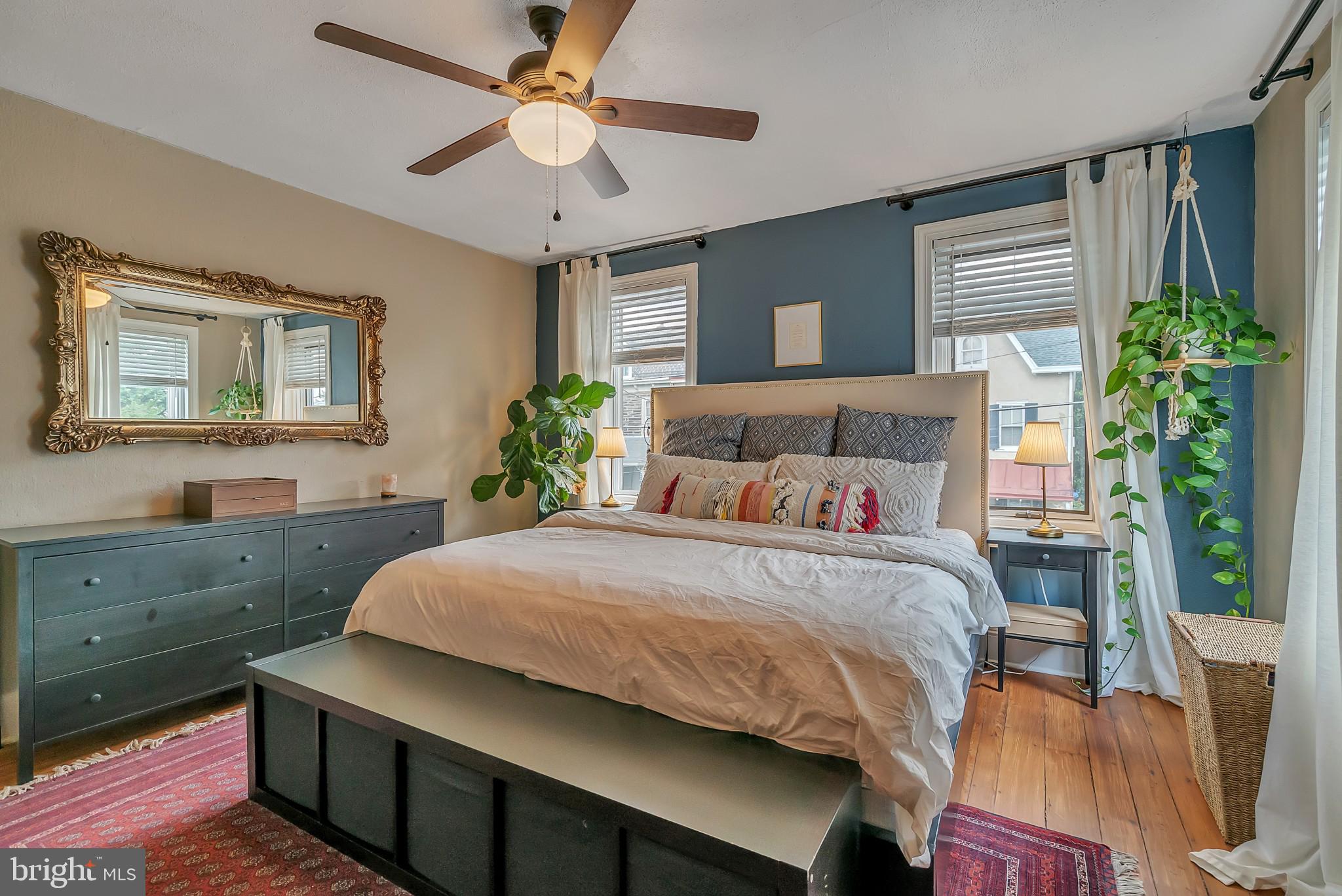 229 Benezet Street Philadelphia, PA 19118 - Photo 23 of 36 a bedroom with a bed and a table