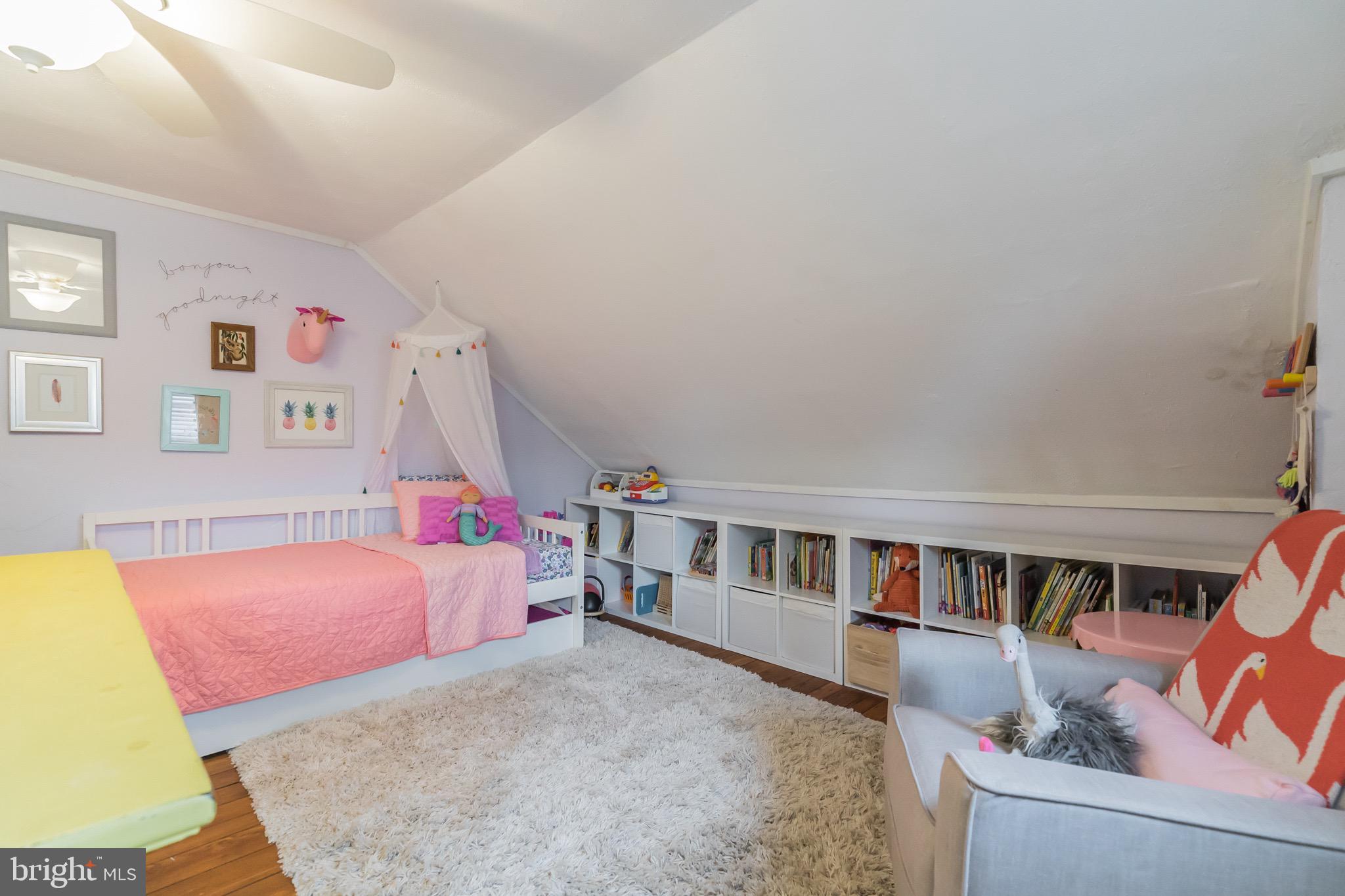 229 Benezet Street Philadelphia, PA 19118 - Photo 30 of 36 a bedroom with furniture and a baby crib