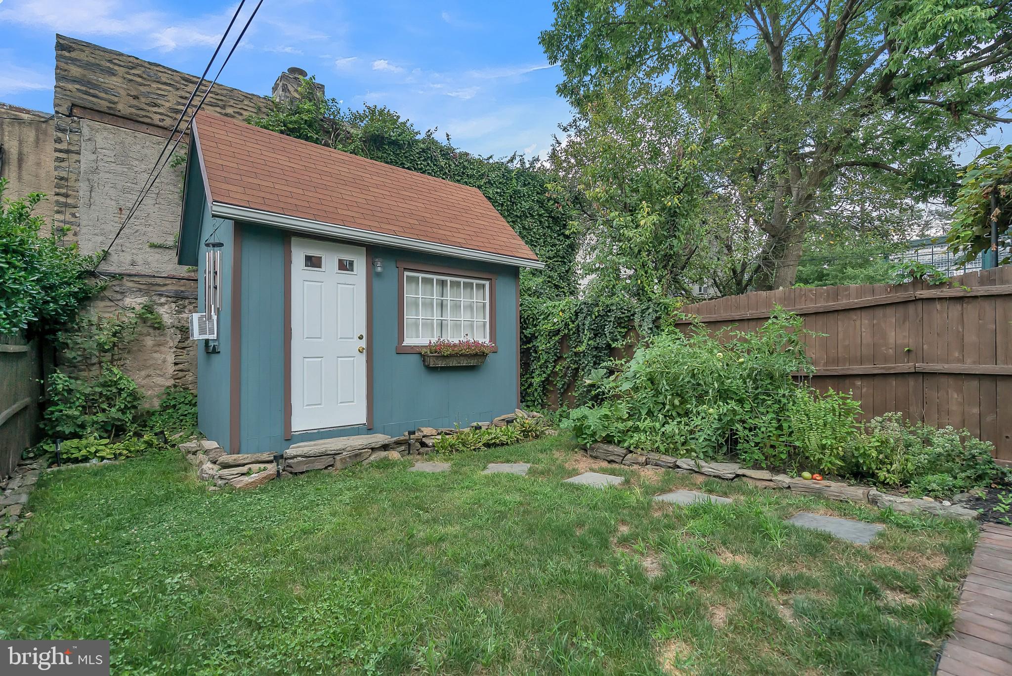 229 Benezet Street Philadelphia, PA 19118 - Photo 34 of 36 a front view of a house with garden