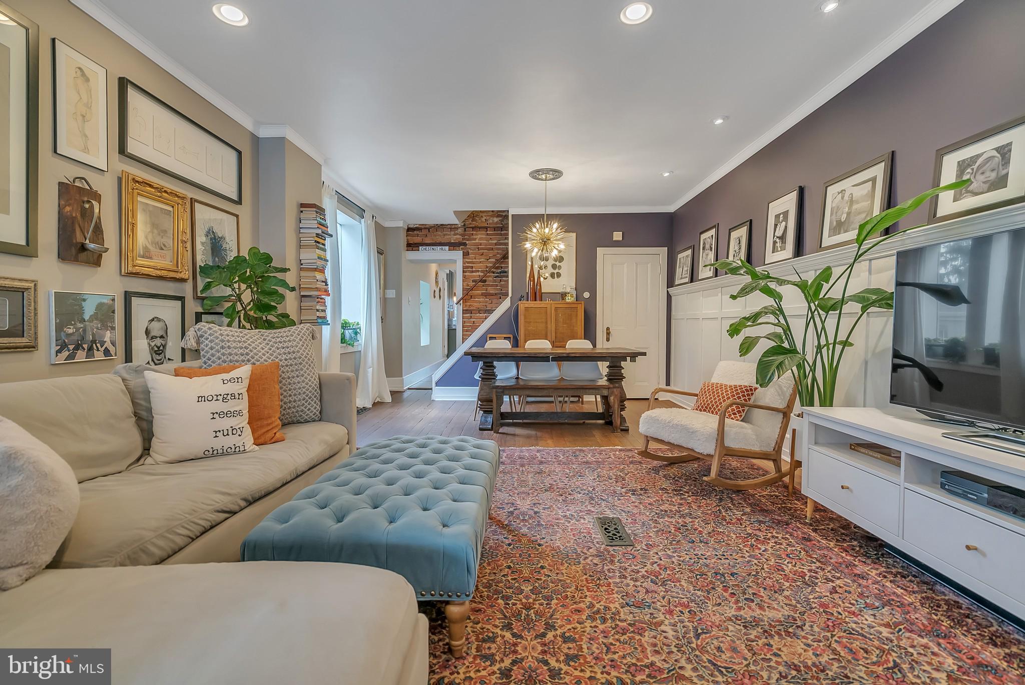 229 Benezet Street Philadelphia, PA 19118 - Photo 5 of 36 a living room with furniture and a flat screen tv