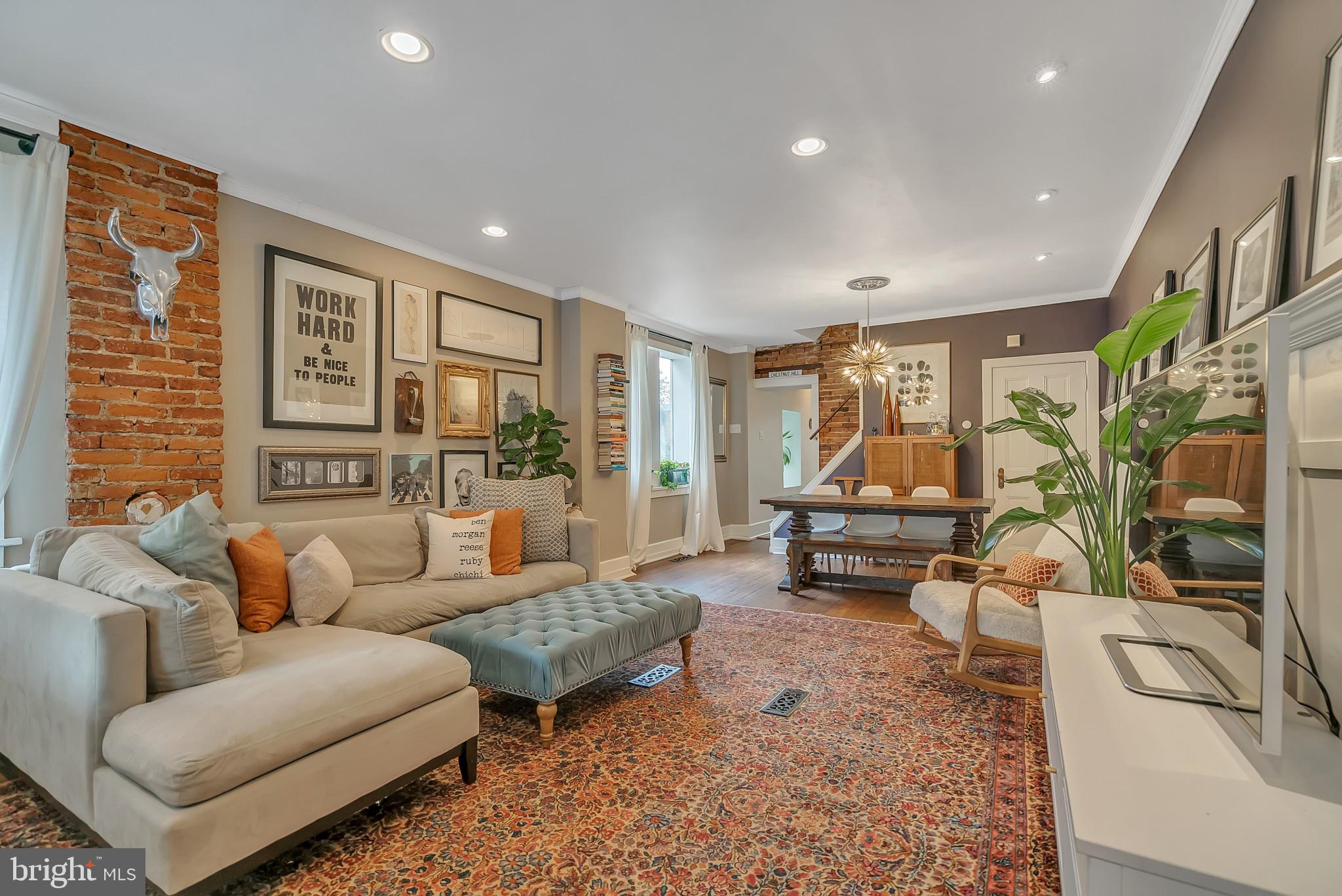 229 Benezet Street Philadelphia, PA 19118 - Photo 6 of 36 a living room with furniture and a large window